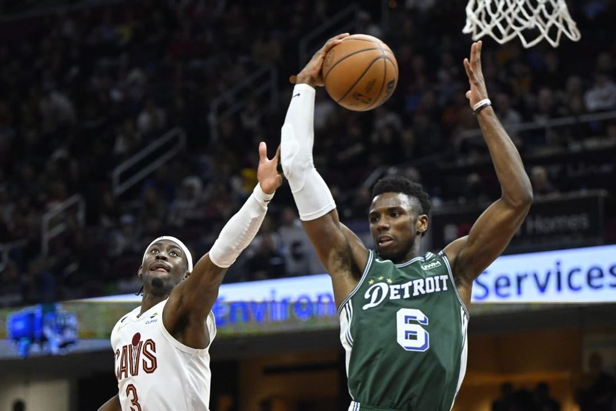 Mar 4, 2023; Cleveland, Ohio, USA; Detroit Pistons guard Hamidou Diallo (6) rebounds beside Cleveland Cavaliers guard Caris LeVert (3)in the fourth quarter at Rocket Mortgage FieldHouse.