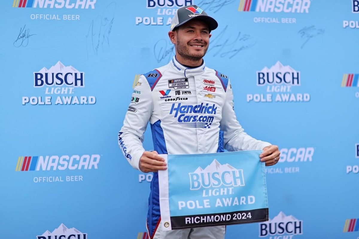 Mar 30, 2024; Richmond, Virginia, USA; NASCAR Cup Series driver Kyle Larson (5) celebrates within the pole after qualifying for the Toyota Owners 400 at Richmond Raceway.