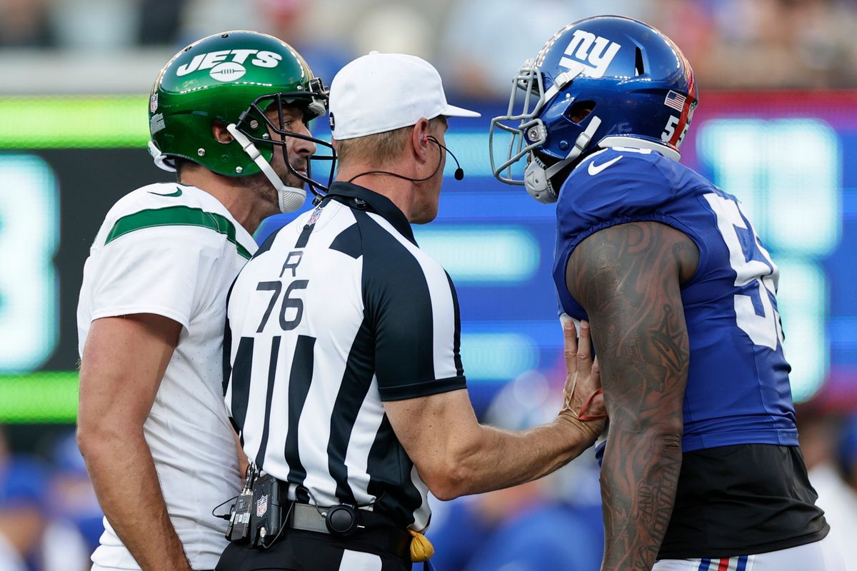 New York Jets QB Aaron Rodgers and New York Giants LB Jihad Ward exchange words