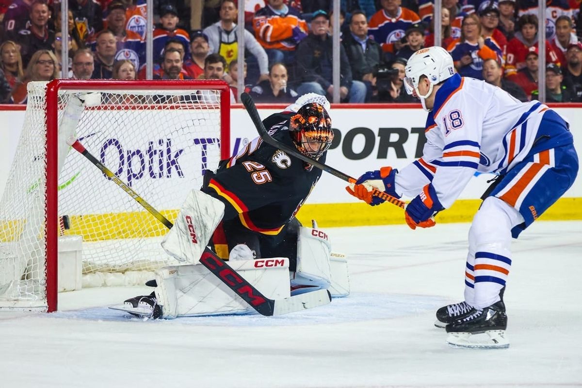 Apr 6, 2024; Calgary, Alberta, CAN; Calgary Flames goaltender Jacob Markstrom (25) makes a save against Edmonton Oilers left wing Zach Hyman (18) during the first period at Scotiabank Saddledome.