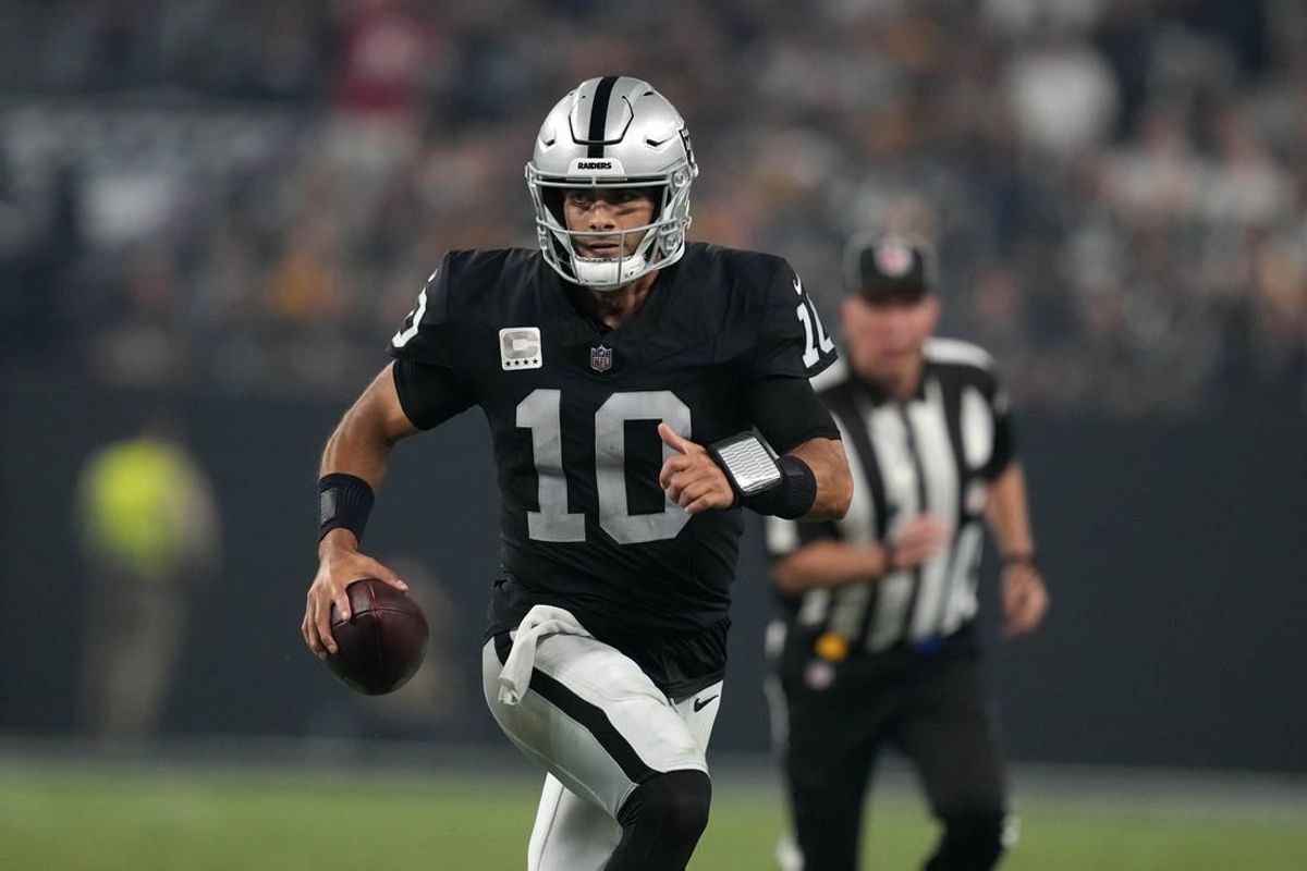 Sep 24, 2023; Paradise, Nevada, USA; Las Vegas Raiders quarterback Jimmy Garoppolo (10) carries the ball against the Pittsburgh Steelers in the second half at Allegiant Stadium.