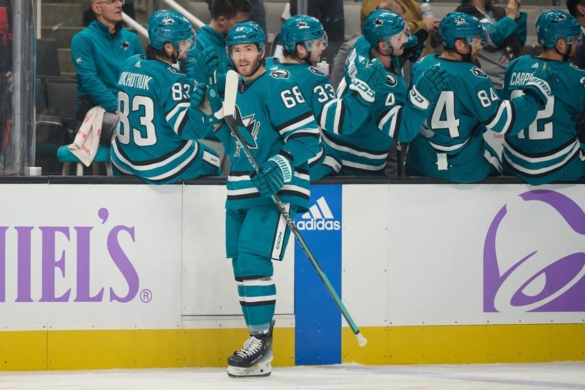 Nov 16, 2023; San Jose, California, USA; San Jose Sharks left wing Mike Hoffman (68) shakes hands with his teammates on the bench after scoring a goal against the St. Louis Blues during the first period at SAP Center at San Jose.