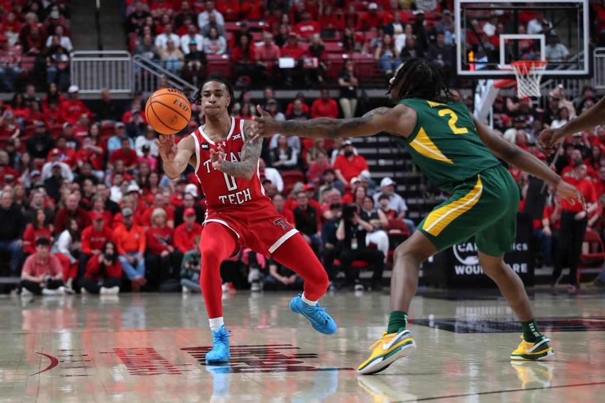 Mar 9, 2024; Lubbock, Texas, USA; Texas Tech Red Raiders guard Chance McMillian (0) passes the ball against Baylor Bears guard Jayden Nunn (2) in the first half at United Supermarkets Arena.