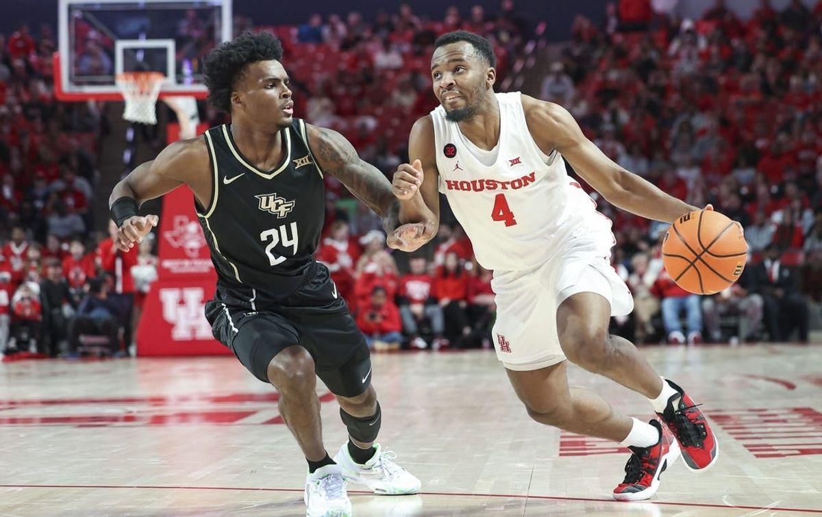 Jan 20, 2024; Houston, Texas, USA; Houston Cougars guard L.J. Cryer (4) drives with the ball as UCF Knights guard Jaylin Sellers (24) defends during the first half at Fertitta Center.
