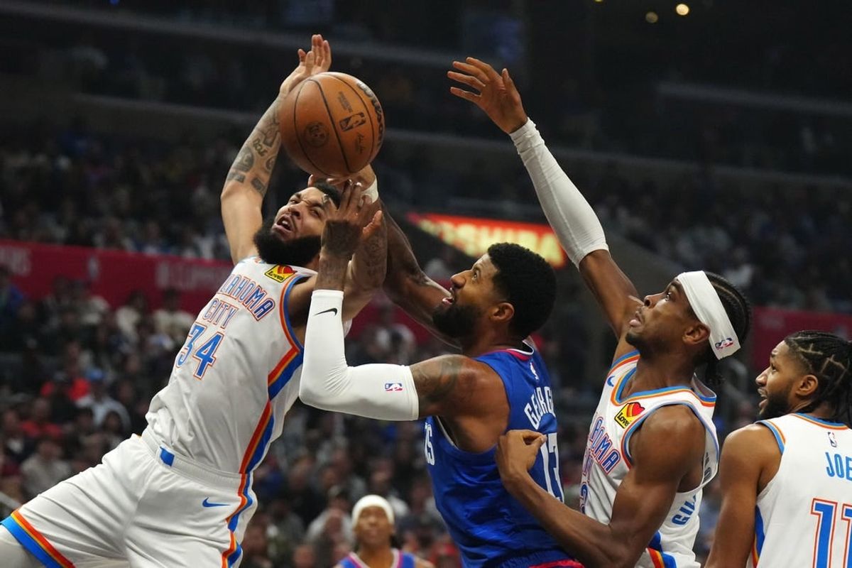 Jan 16, 2024; Los Angeles, California, USA; Oklahoma City Thunder forward Kenrich Williams (34) and guard Shai Gilgeous-Alexander (2) battle for the ball with LA Clippers forward Paul George (13) in the first half at Crypto.com Arena.