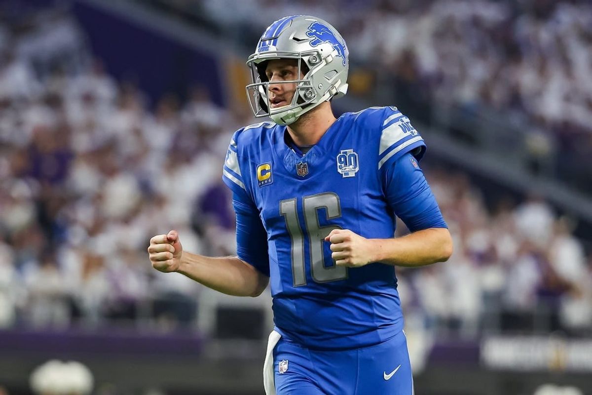 Dec 24, 2023; Minneapolis, Minnesota, USA; Detroit Lions quarterback Jared Goff (16) celebrates after running back Jahmyr Gibbs (26) runs for a touchdown against the Minnesota Vikings during the fourth quarter at U.S. Bank Stadium.