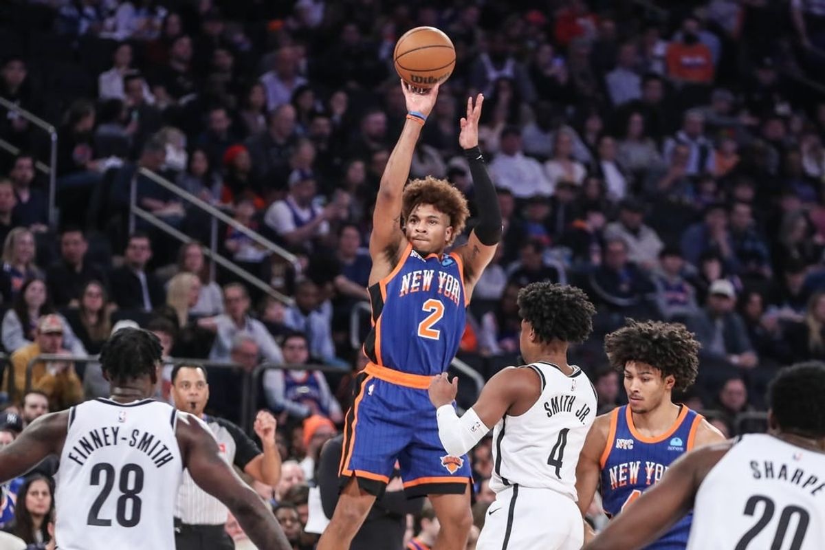 Mar 23, 2024; New York, New York, USA;  New York Knicks guard Miles McBride (2) takes a three point shot in the first quarter against the Brooklyn Nets at Madison Square Garden.