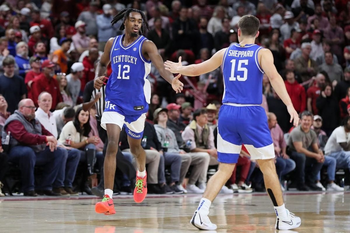 Jan 27, 2024; Fayetteville, Arkansas, USA; Kentucky Wildcats guard Antonio Reeves (12) celebrates with guard Reed Sheppard (15) after making a three point shot in the second half against the Arkansas Razorbacks at Bud Walton Arena. Kentucky won 63-57.