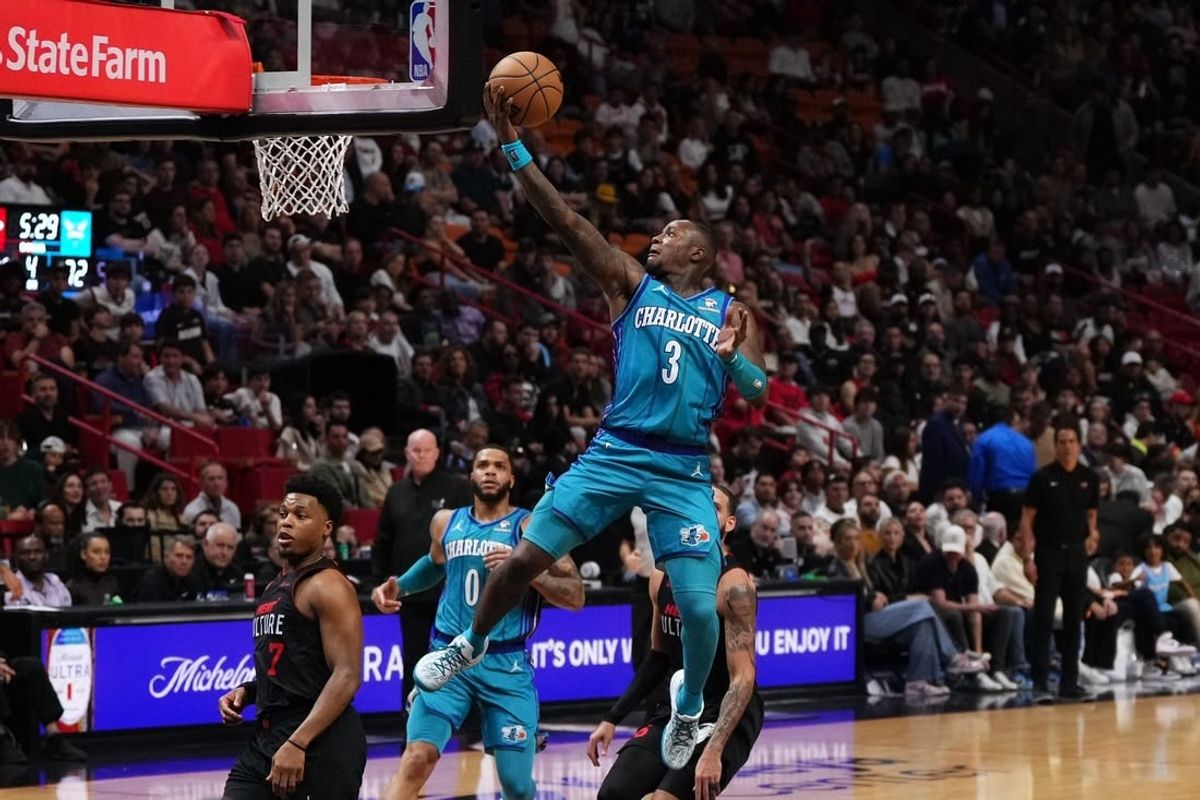 Jan 14, 2024; Miami, Florida, USA; Charlotte Hornets guard Terry Rozier (3) puts up a shot against the Miami Heat during the second half at Kaseya Center.