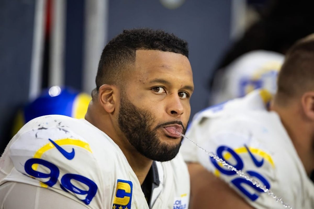 Nov 26, 2023; Glendale, Arizona, USA; Los Angeles Rams defensive tackle Aaron Donald (99) spits water out of his mouth against the Arizona Cardinals at State Farm Stadium.