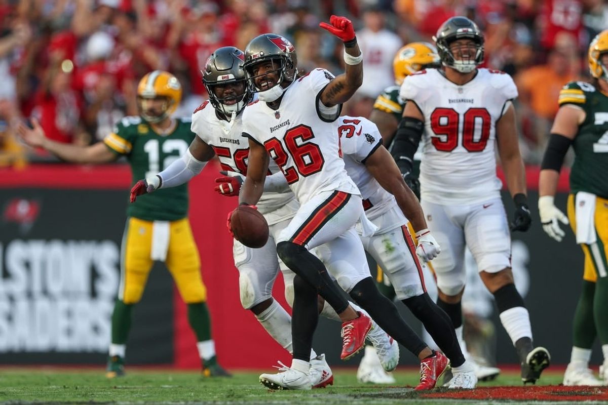 Sep 25, 2022; Tampa, Florida, USA;  Tampa Bay Buccaneers safety Logan Ryan (26) reacts after intercepting the ball against the Green Bay Packers in the third quarter at Raymond James Stadium.