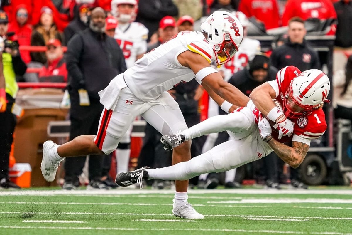Nov 11, 2023; Lincoln, Nebraska, USA; Nebraska Cornhuskers wide receiver Billy Kemp IV (1) is brought down by Maryland Terrapins defensive back Beau Brade (2) during the second quarter at Memorial Stadium.