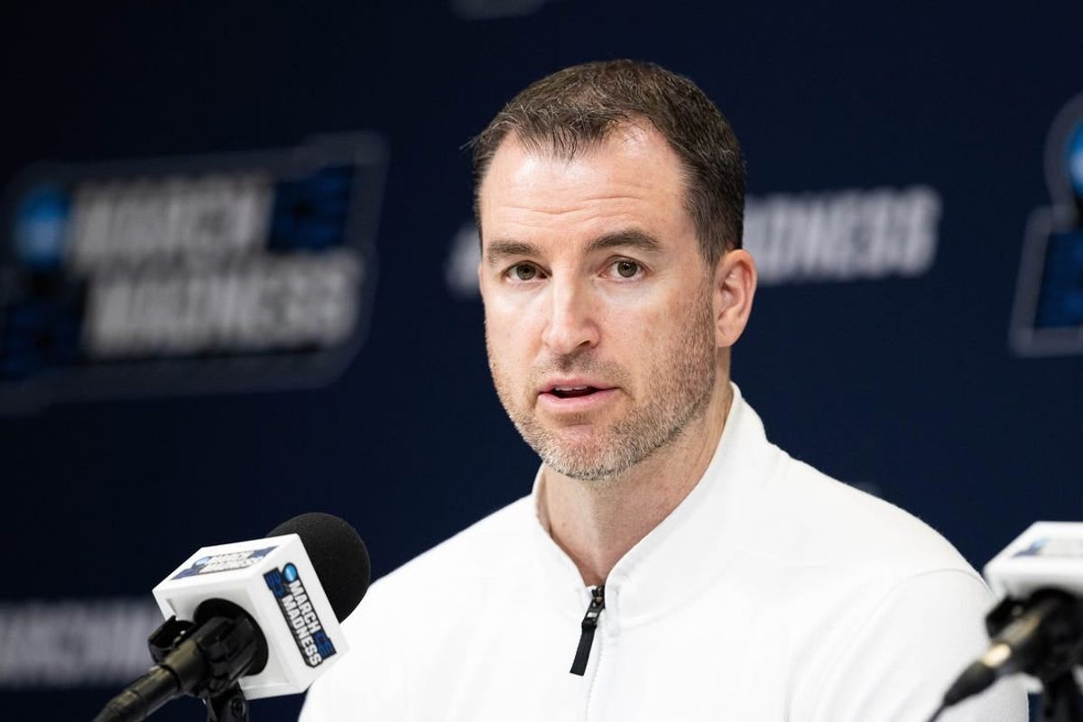 Mar 21, 2024; Indianapolis, IN, USA; Utah State Aggies head coach Danny Sprinkle talks to the media during the practice day at Gainbridge FieldHouse.
