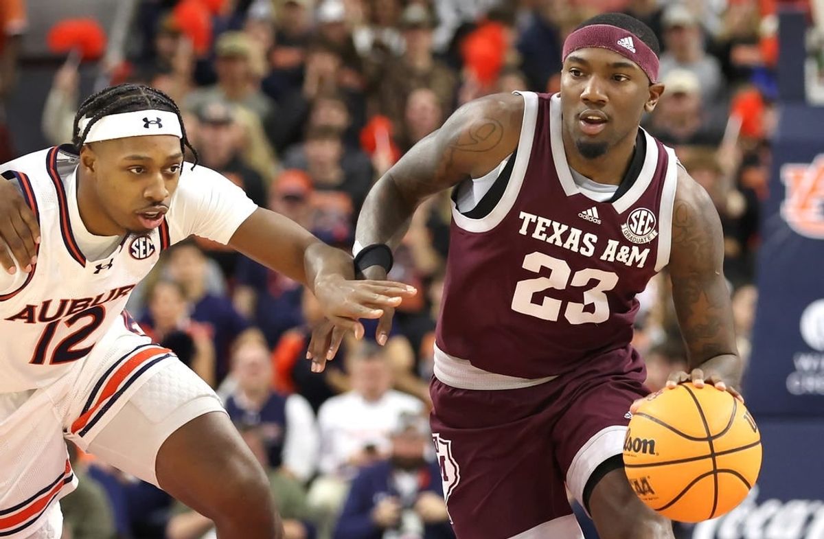 Jan 9, 2024; Auburn, Alabama, USA; Auburn Tigers guard Denver Jones (12) chases Texas A&M Aggies guard Tyrece Radford (23) during the first half at Neville Arena.