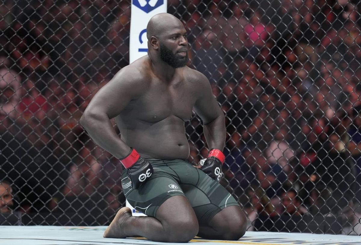 May 13, 2023; Charlotte, North Carolina, USA; Jairzinho Rozenstruik (red gloves) reacts after a loss to Jailton Almeida (blue gloves) in a heavyweight bout during UFC Fight Night at Spectrum Center.