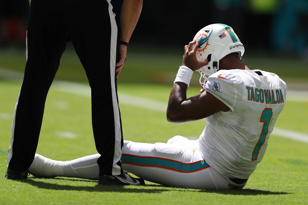 Tua Tagovailoa holds his head during Sunday’s win over the Bills.