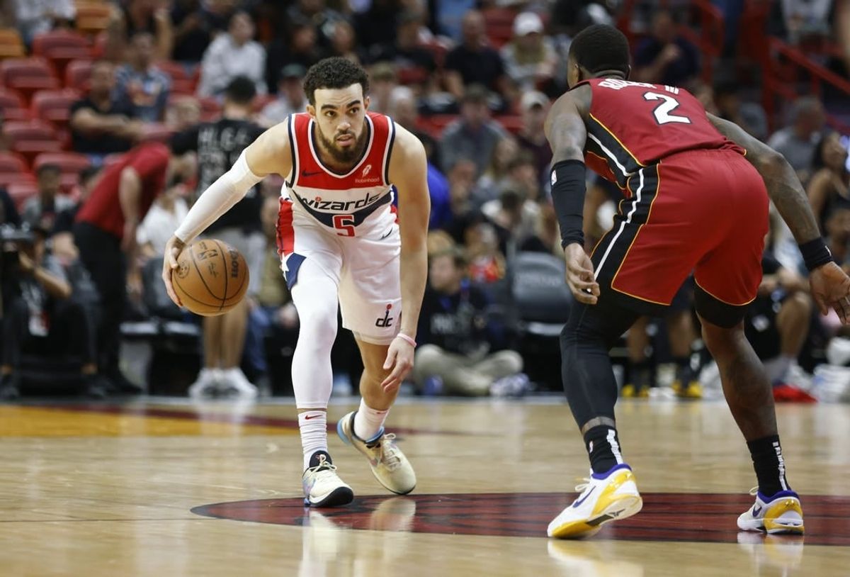 Mar 10, 2024; Miami, Florida, USA; Miami Heat guard Terry Rozier (2) defends Washington Wizards guard Tyus Jones (5) during the second half at Kaseya Center.