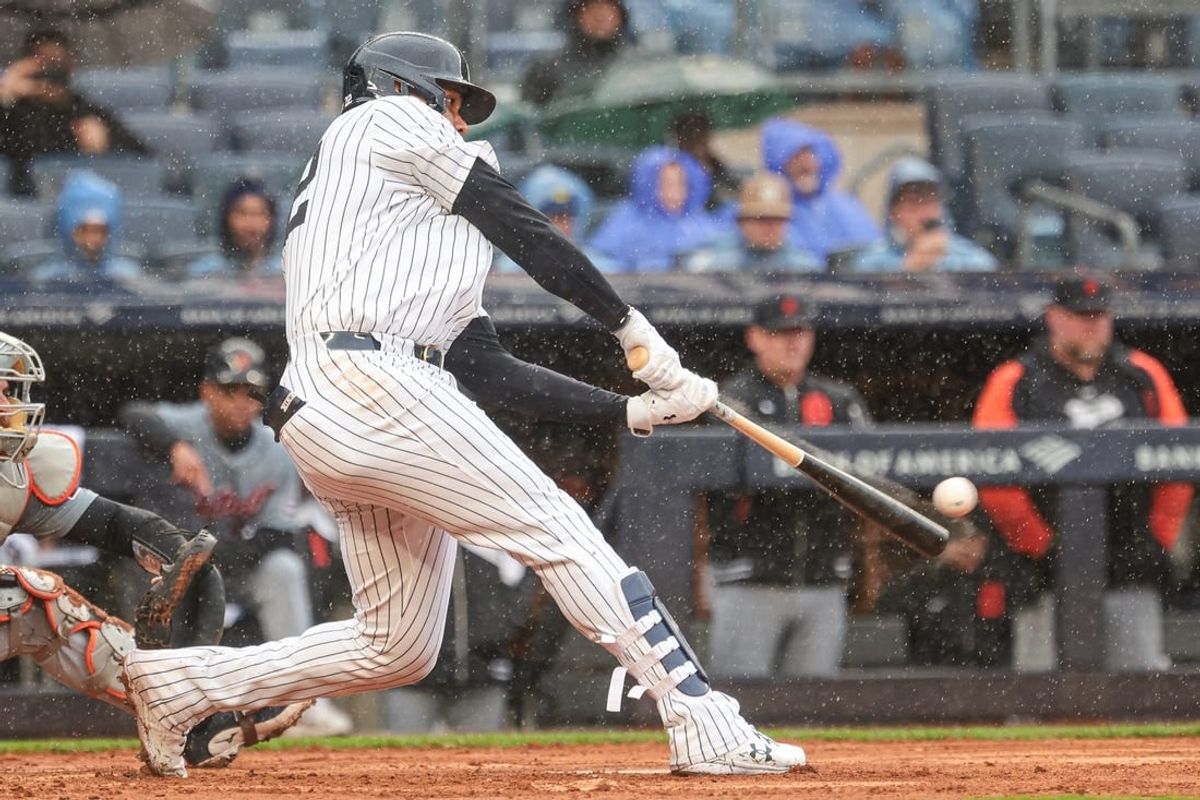 May 5, 2024; Bronx, New York, USA; New York Yankees right fielder Juan Soto (22) hits a three RBI double during the seventh inning against the Detroit Tigers at Yankee Stadium.