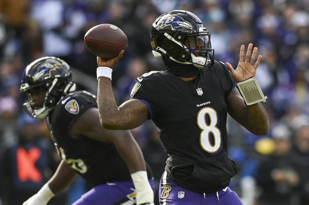 Dec 31, 2023; Baltimore, Maryland, USA; Baltimore Ravens quarterback Lamar Jackson (8) throws during the  during the first quarter against the Miami Dolphins at M&T Bank Stadium.