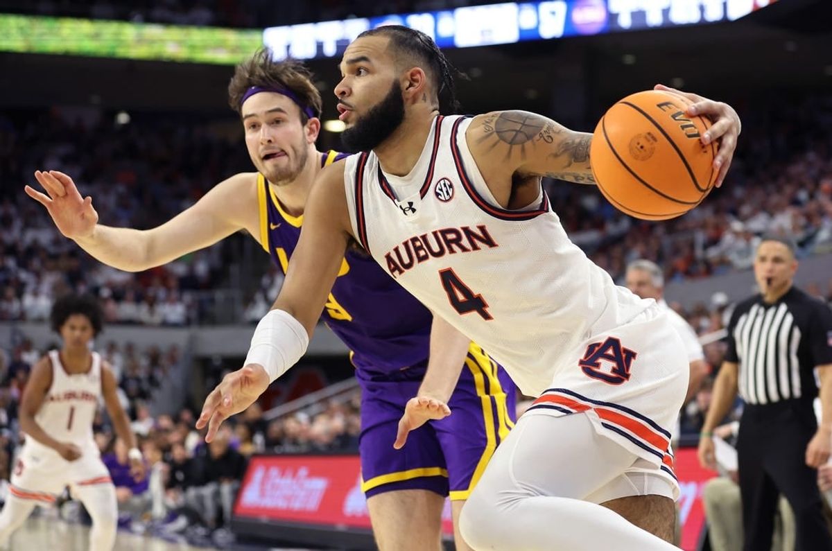 Jan 13, 2024; Auburn, Alabama, USA; Auburn Tigers forward Johni Broome (4) drives to the goal during the second half against the LSU Tigers at Neville Arena.