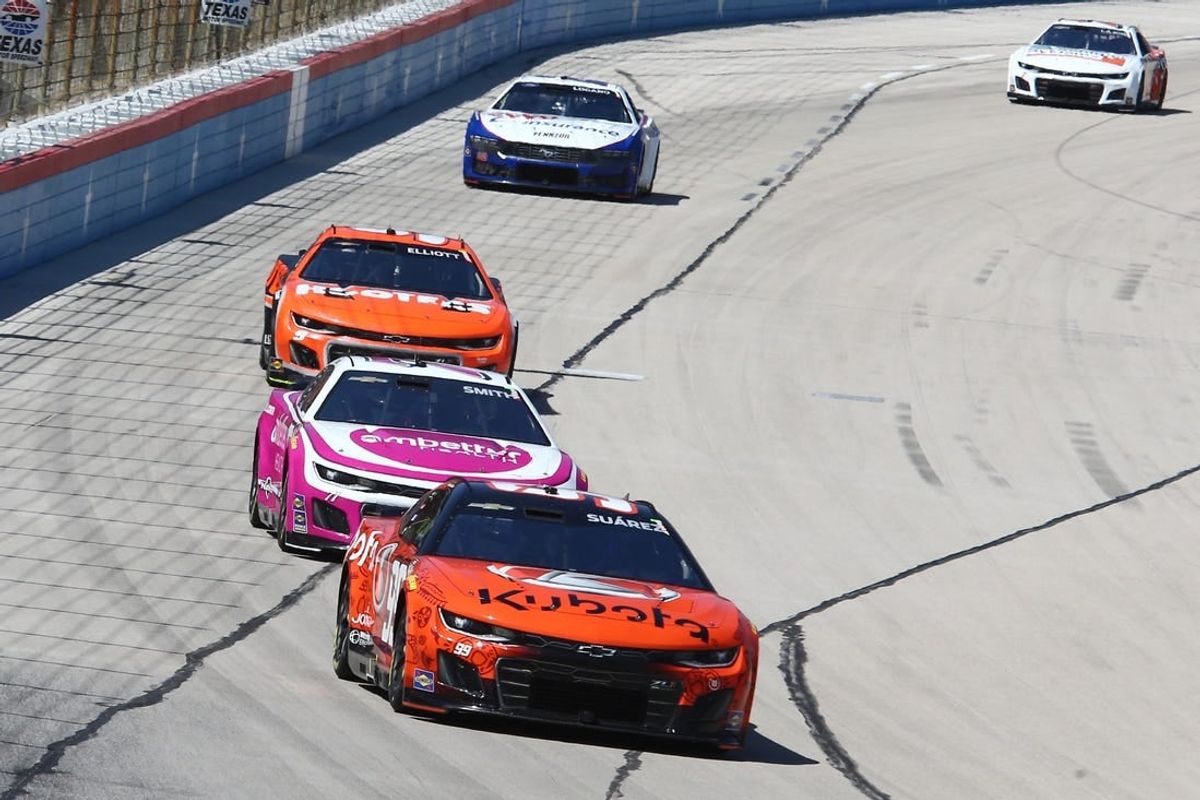 Apr 14, 2024; Fort Worth, Texas, USA;  NASCAR Cup Series driver Daniel Suarez (99) leads driver Zane Smith (71) and driver Chase Elliott (9) during the NASCAR Cup Series AutoTrader EchoPark 400 at Texas Motor Speedway.