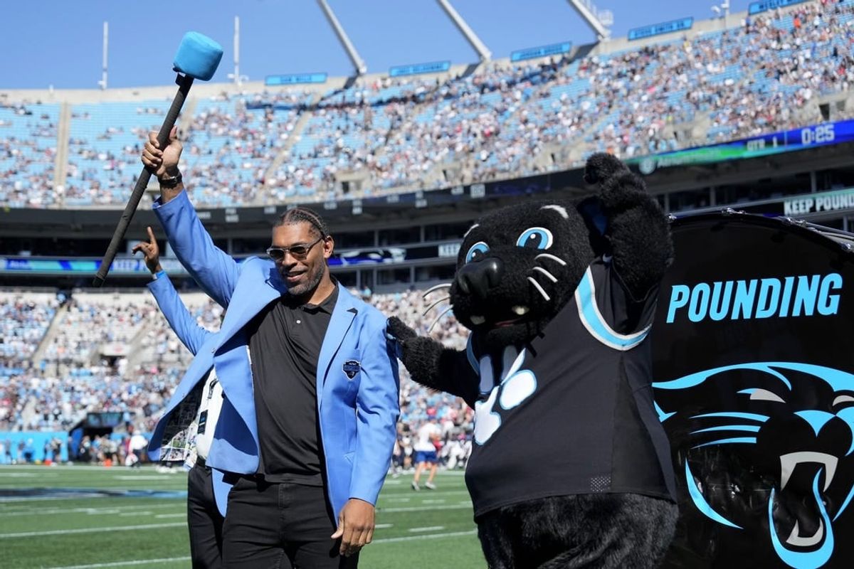 Oct 29, 2023; Charlotte, North Carolina, USA; Former Carolina Panthers great Julius Peppers is honored on the field before the game at Bank of America Stadium.