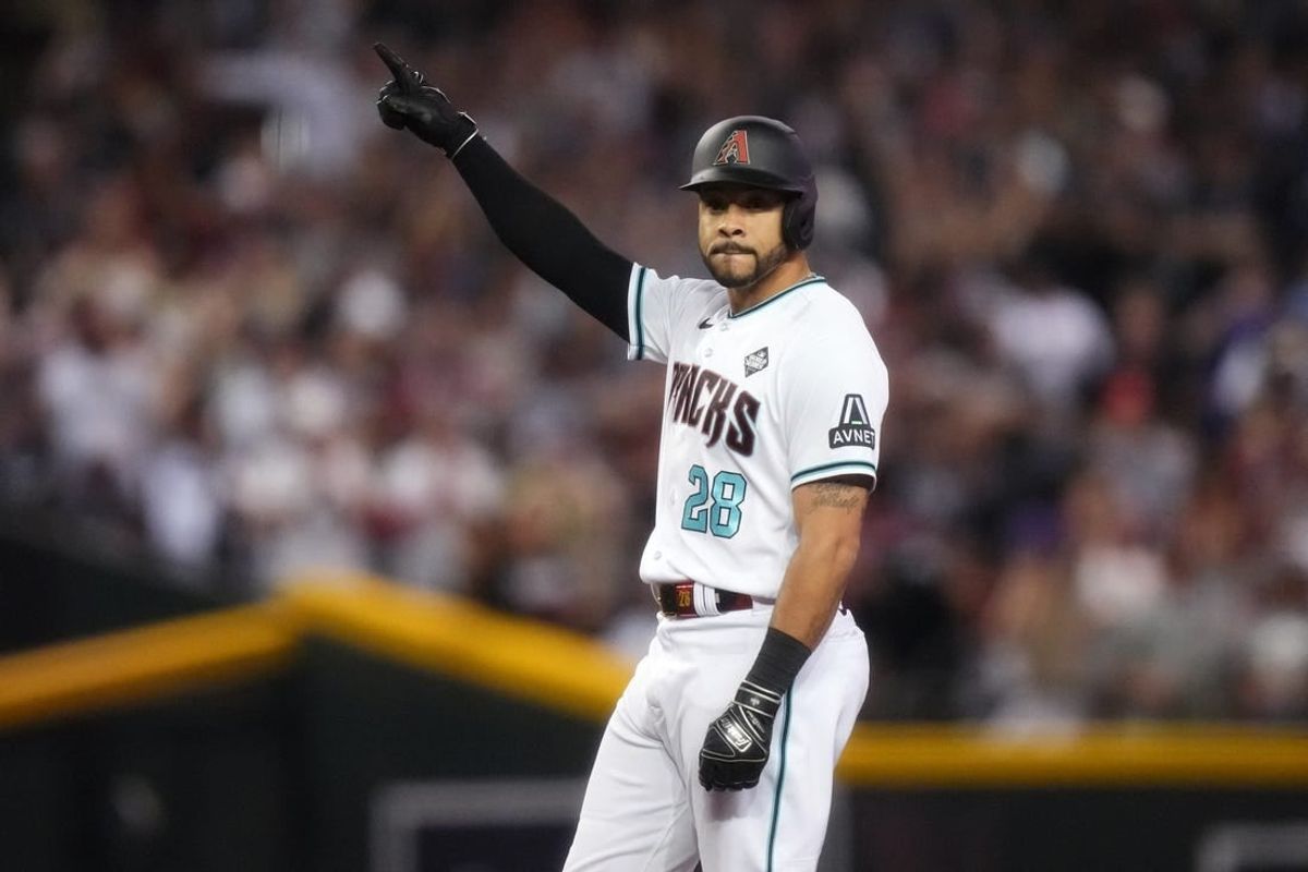 Arizona Diamondbacks designated hitter Tommy Pham (28) reacts after hitting a double during the seventh inning against the Texas Rangers in game three of the 2023 World Series at Chase Field in Phoenix, Ariz., on Oct. 30, 2023.