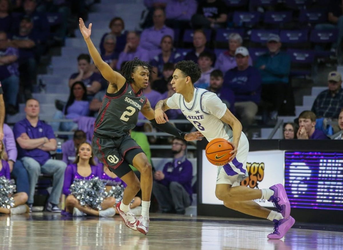 Jan 30, 2024; Manhattan, Kansas, USA; Kansas State Wildcats guard Dorian Finister (3) dribbles against Oklahoma Sooners guard Javian McCollum (2) during the second half at Bramlage Coliseum.