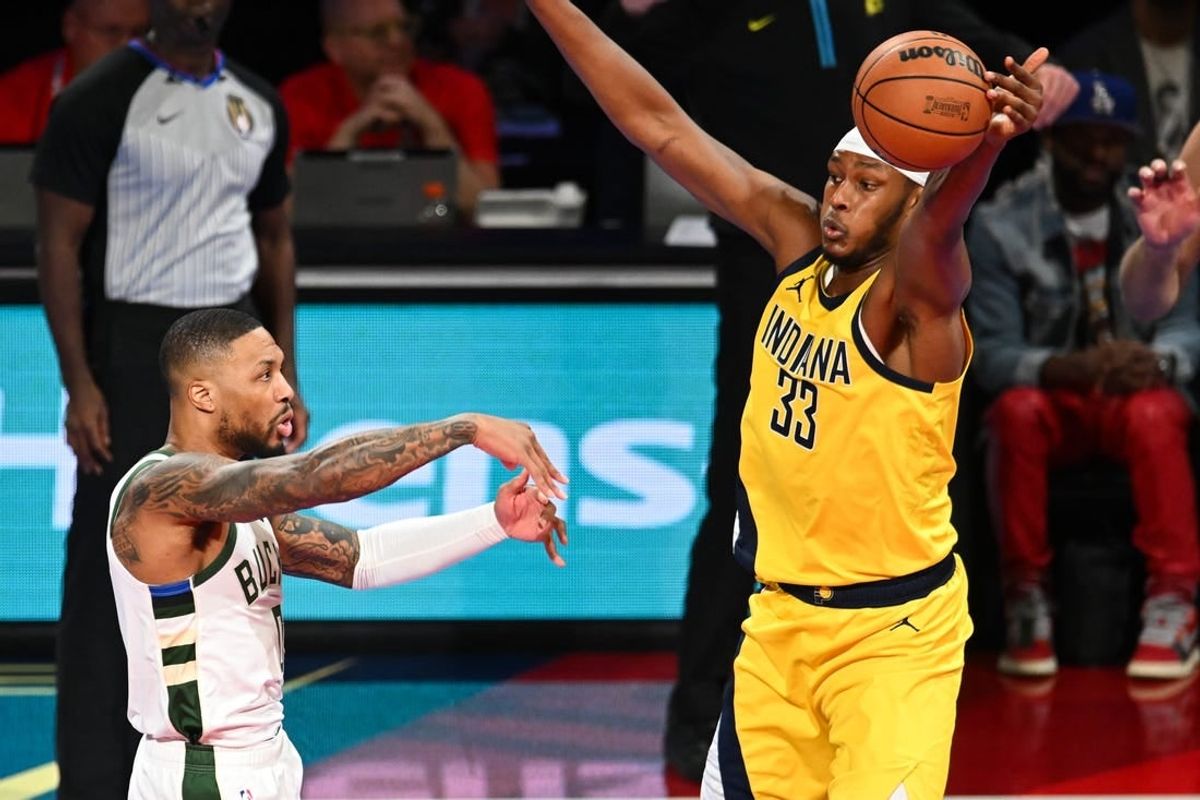 Dec 7, 2023; Las Vegas, Nevada, USA; Indiana Pacers center Myles Turner (33) gets a hand on a pass by Milwaukee Bucks guard Damian Lillard (0) during the first quarter at T-Mobile Arena.