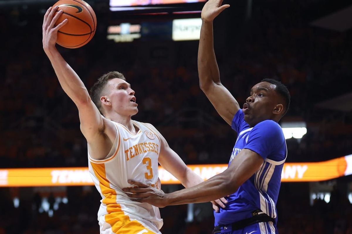 Mar 9, 2024; Knoxville, Tennessee, USA; Tennessee Volunteers guard Dalton Knecht (3) goes to the basket against Kentucky Wildcats forward Ugonna Onyenso (33) during the first half at Thompson-Boling Arena at Food City Center.