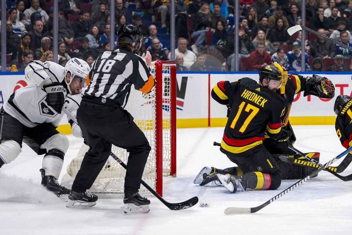 Mar 25, 2024; Vancouver, British Columbia, CAN; Vancouver Canucks defenseman Filip Hronek (17) watches as Los Angeles Kings forward Anze Kopitar (11) scores on goalie Casey DeSmith (29) in the second period at Rogers Arena.