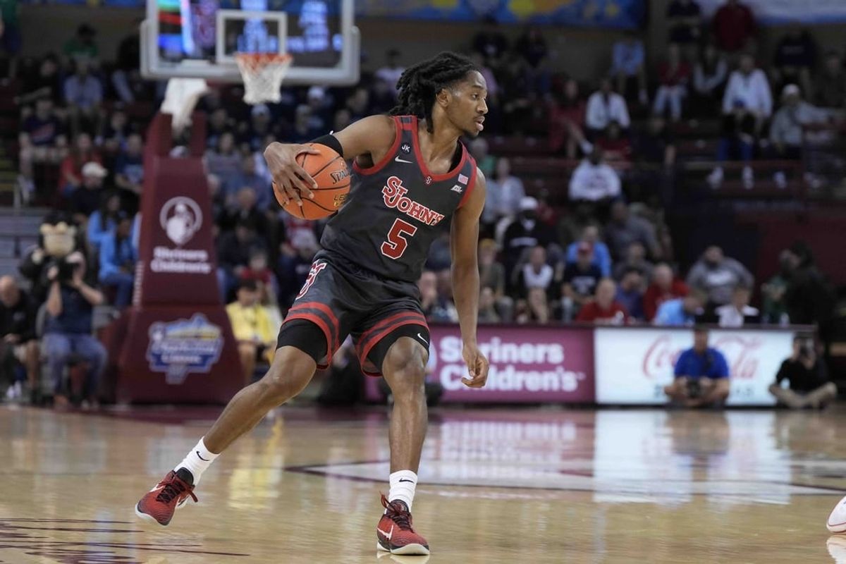 Nov 17, 2023; Charleston, SC, USA; St. John's Red Storm guard Daniss Jenkins (5) drives the ball in the first half against the Dayton Flyers at TD Arena.