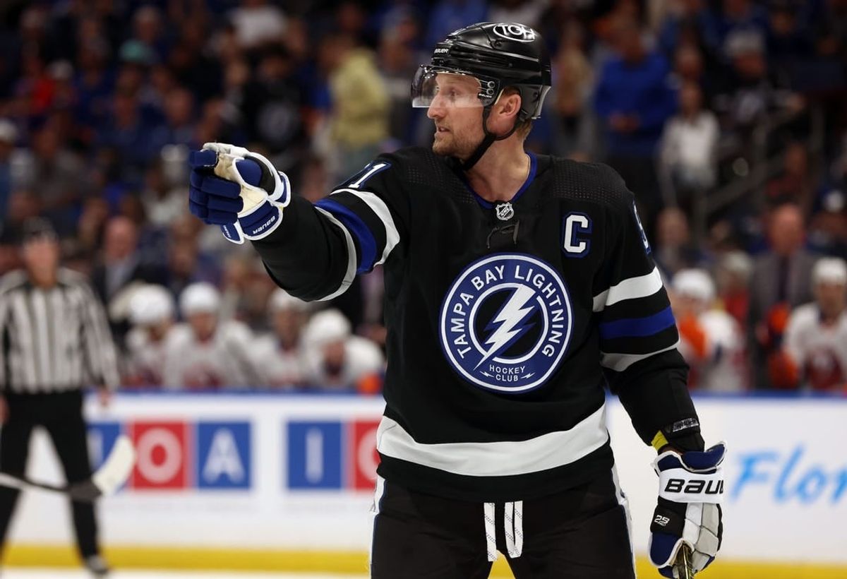 Mar 30, 2024; Tampa, Florida, USA; Tampa Bay Lightning center Steven Stamkos (91) points against the New York Islanders during the first period at Amalie Arena.