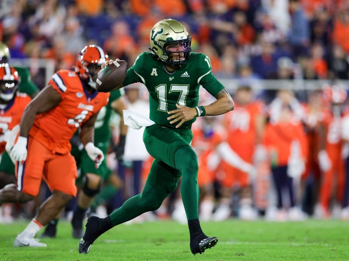 Dec 21, 2023; Boca Raton, FL, USA; South Florida Bulls quarterback Byrum Brown (17) drops back to pass against the Syracuse Orange in the first quarter during the RoofClaim.com Boca Raton Bowl at FAU Stadium.