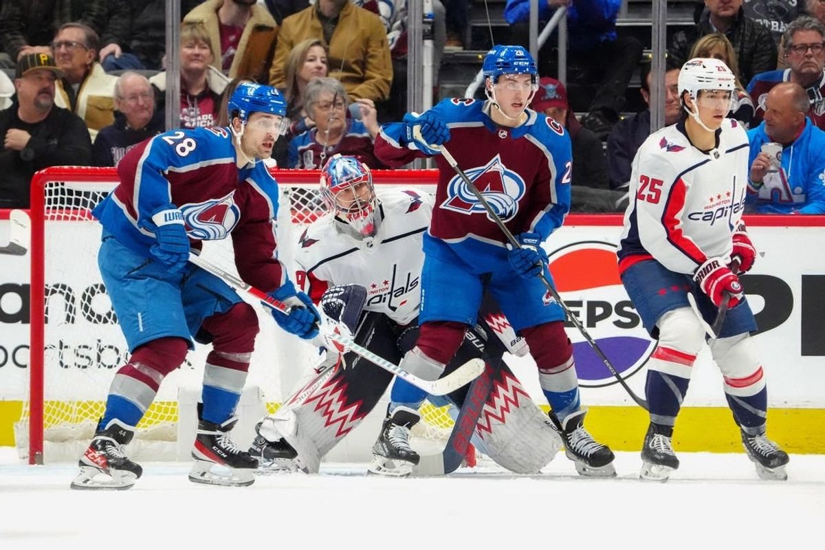 Jan 24, 2024; Denver, Colorado, USA; Colorado Avalanche left wing Miles Wood (28) and center Ross Colton (20) and Washington Capitals goaltender Charlie Lindgren (79) and defenseman Ethan Bear (25) during the first period against the Colorado Avalanche at Ball Arena.