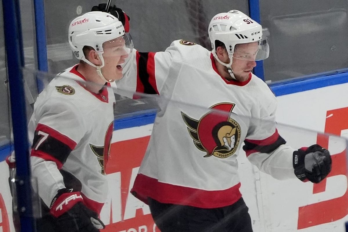 Feb 19, 2024; Tampa, Florida, USA; Ottawa Senators right wing Vladimir Tarasenko (91) is congratulated by left wing Brady Tkachuk (7) after scoring a goal against the Tampa Bay Lightning during the third period at Amalie Arena.