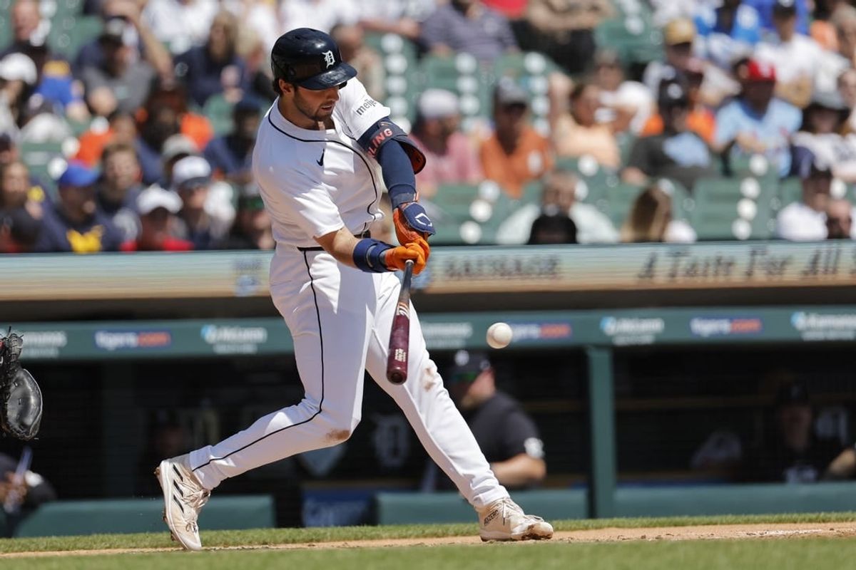 May 1, 2024; Detroit, Michigan, USA; Detroit Tigers center fielder Matt Vierling (8) hits a single in the second inning against the St. Louis Cardinals at Comerica Park.