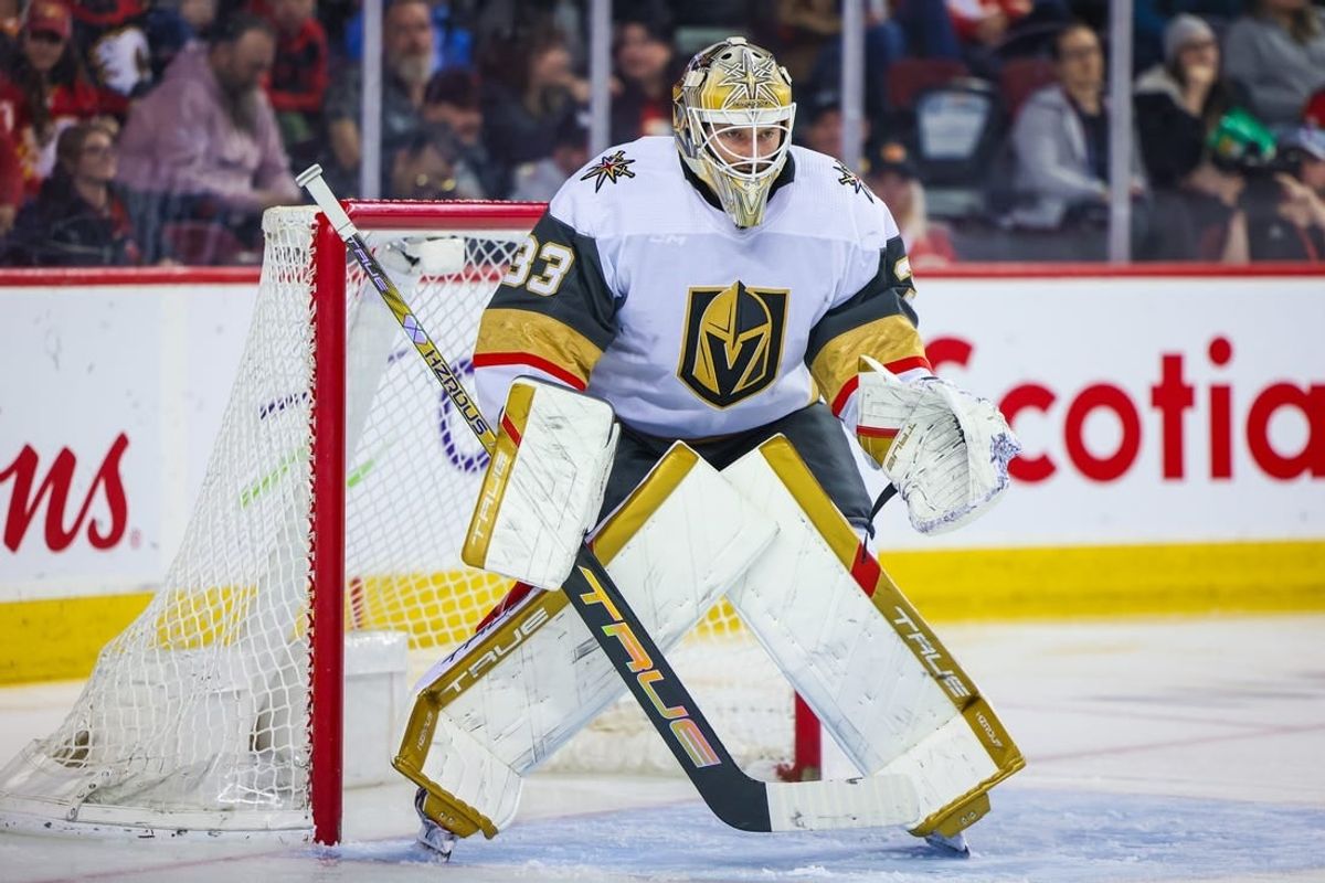 Mar 14, 2024; Calgary, Alberta, CAN; Vegas Golden Knights goaltender Adin Hill (33) guards his net against the Calgary Flames during the second period at Scotiabank Saddledome.