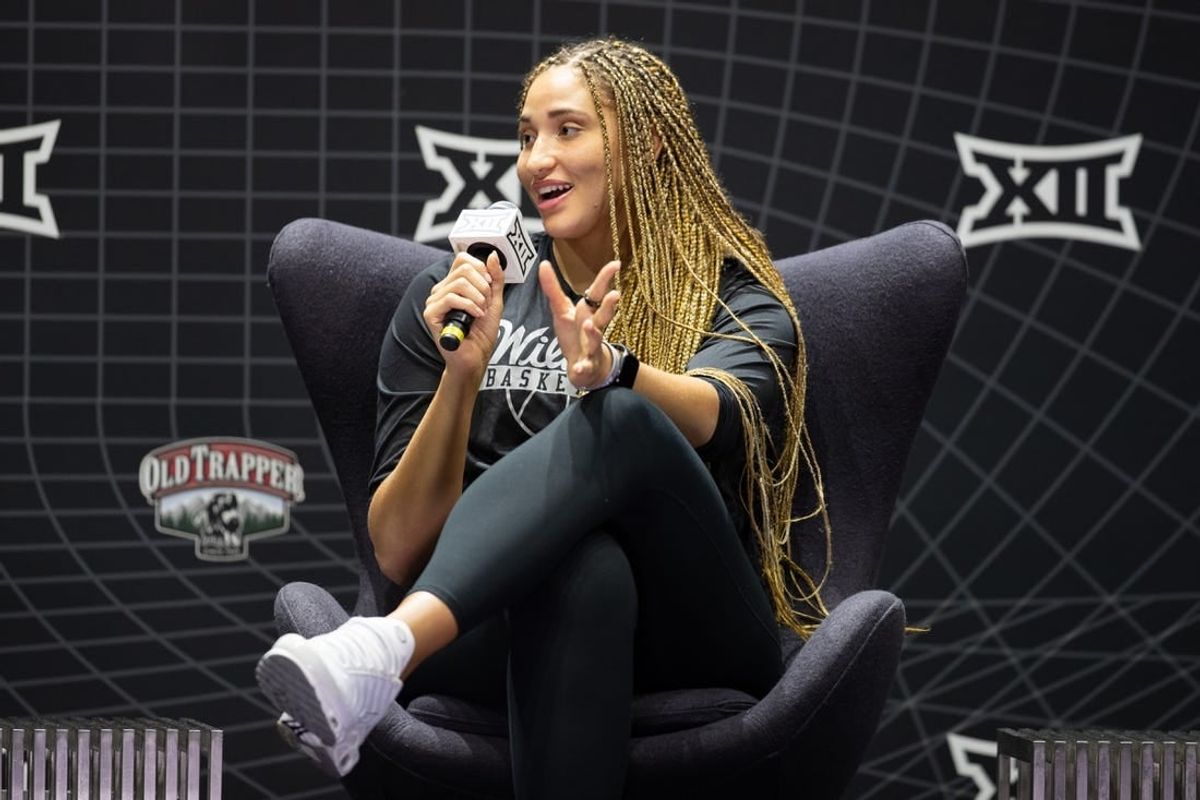 Oct 17, Kansas City, MO, USA; Kansas State player Ayoka Lee answers questions at the Big 12 Women s Basketball Tipoff at T-Mobile Center.