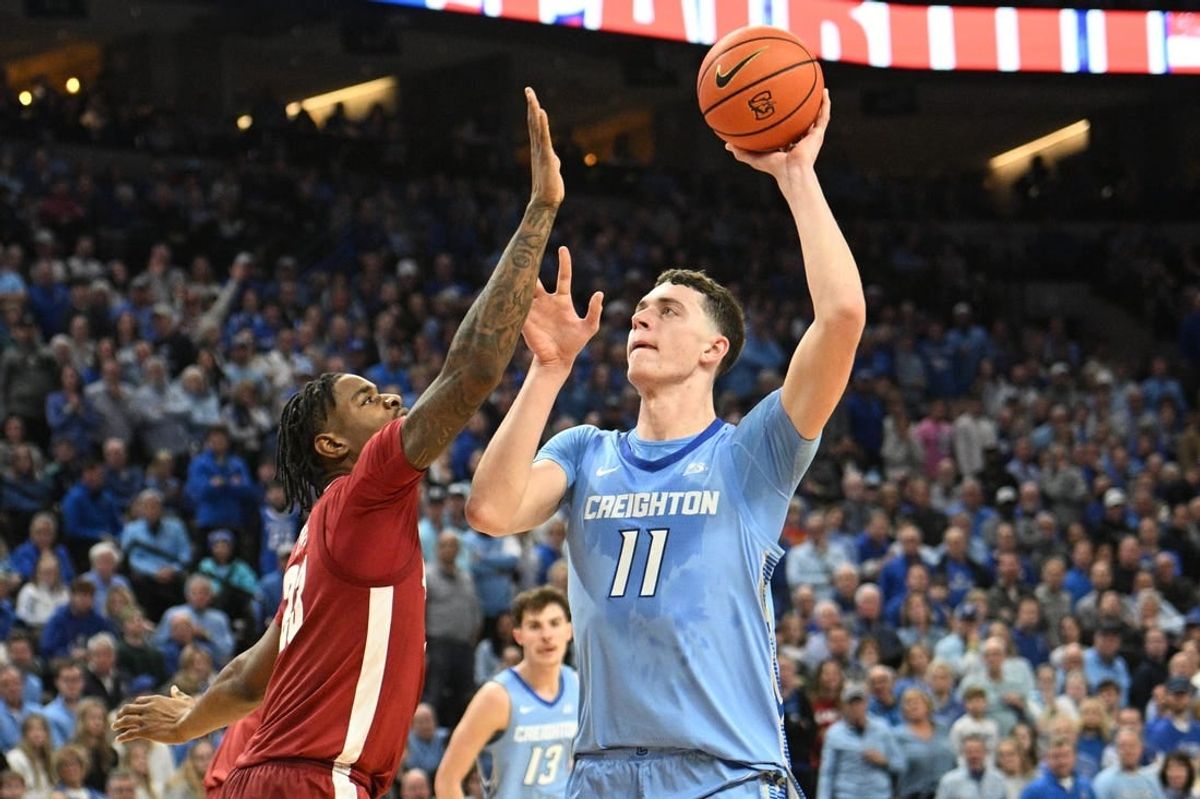 Dec 16, 2023; Omaha, Nebraska, USA; Creighton Bluejays center Ryan Kalkbrenner (11) attempts a shot against Alabama Crimson Tide forward Nick Pringle (23) in the second half at CHI Health Center Omaha.