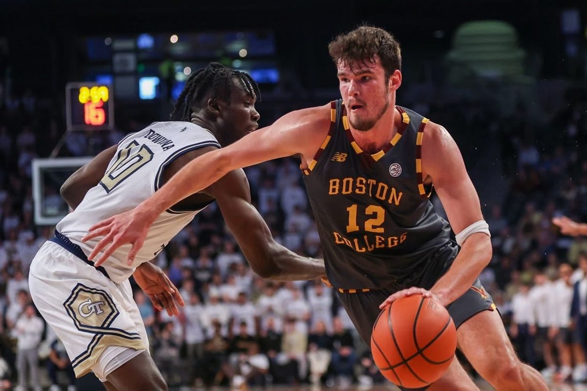 Jan 6, 2024; Atlanta, Georgia, USA; Boston College Eagles forward Quinten Post (12) drives on Georgia Tech Yellow Jackets forward Ebenezer Dowuona (10) in the first half at McCamish Pavilion.