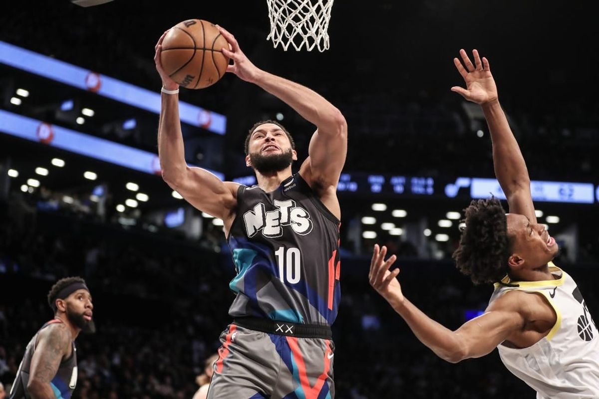 Jan 29, 2024; Brooklyn, New York, USA;  Brooklyn Nets guard Ben Simmons (10) grabs a rebound past Utah Jazz guard Collin Sexton (2) in the second quarter against the Utah Jazz at Barclays Center.