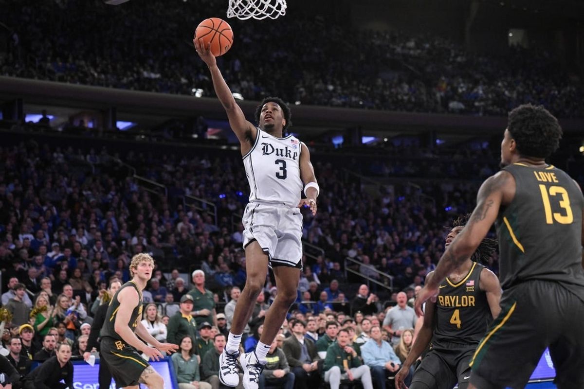 Dec 20, 2023; New York, New York, USA; Duke Blue Devils guard Jeremy Roach (3) drives to the basket as Baylor Bears guard Langston Love (13) looks on during the first half at Madison Square Garden.