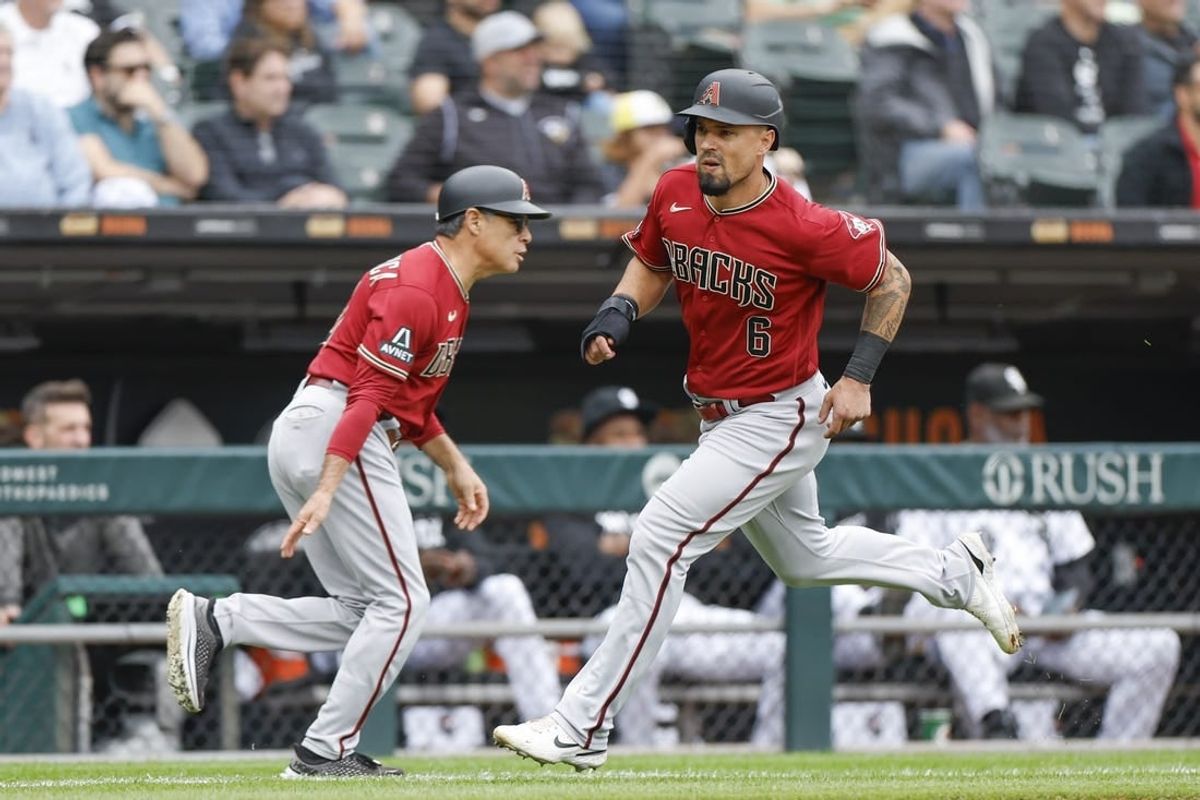 Sep 27, 2023; Chicago, Illinois, USA; Arizona Diamondbacks third baseman Jace Peterson (6) runs to score against the Chicago White Sox during the third inning at Guaranteed Rate Field.