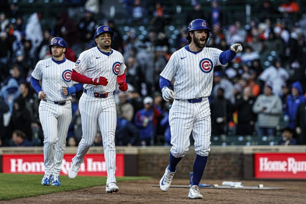 Apr 24, 2024; Chicago, Illinois, USA; Chicago Cubs shortstop Dansby Swanson (7) celebrates with teammates after hitting a three-run home run against the Houston Astros during the first inning at Wrigley Field.
