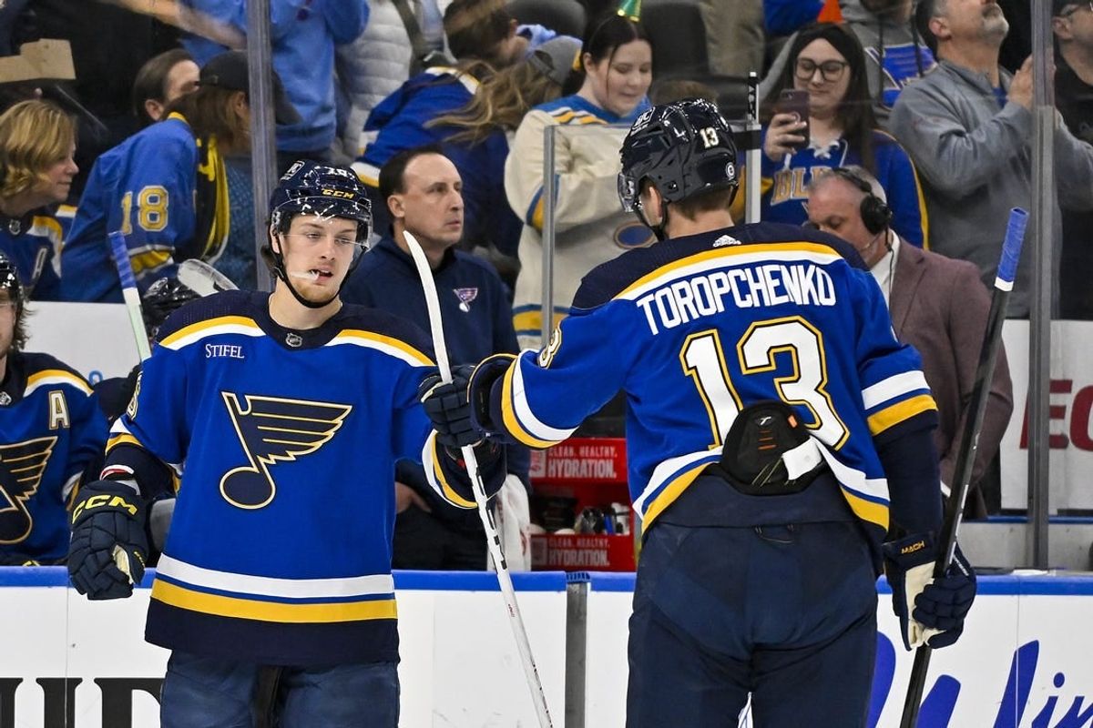 Mar 28, 2024; St. Louis, Missouri, USA;  St. Louis Blues center Zack Bolduc (76) is congratulated by right wing Alexey Toropchenko (13) after scoring against the Calgary Flames during the first period at Enterprise Center.