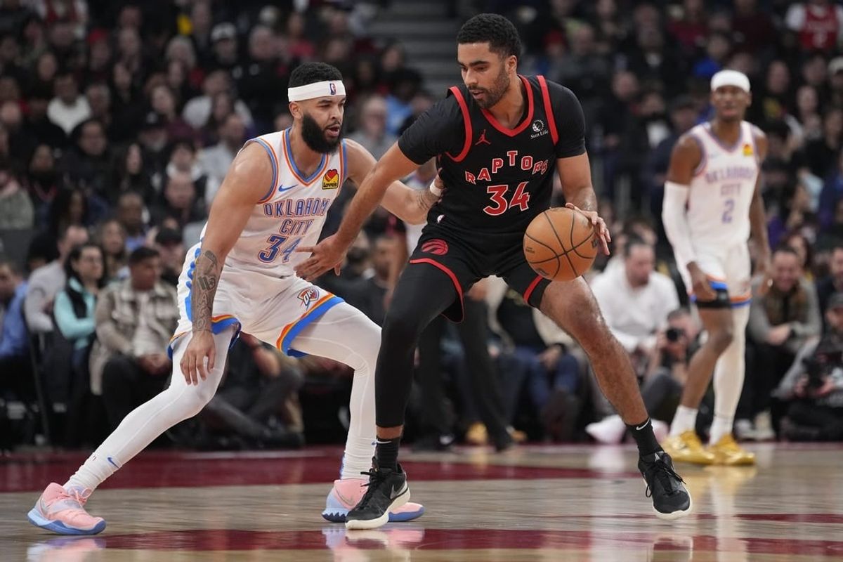 Mar 22, 2024; Toronto, Ontario, CAN; Toronto Raptors forward Jontay Porter (34) controls the ball against Oklahoma City Thunder forward Kenrich Williams (34) during the first half at Scotiabank Arena.