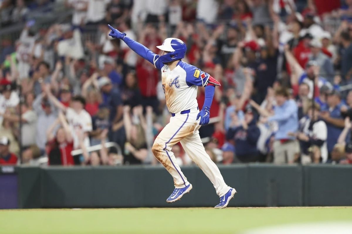 Apr 20, 2024; Cumberland, Georgia, USA;  Atlanta Braves catcher Travis d'Arnaud (16) reacts to his home run against the Texas Rangers in the eighth inning at Truist Park.