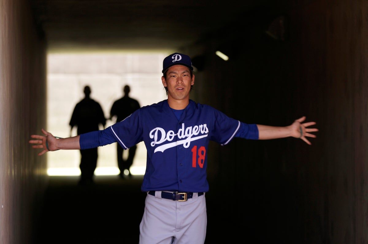 Kenta Maeda stretches in the tunnel before a spring training game in Phoenix. Via  [object Object] .