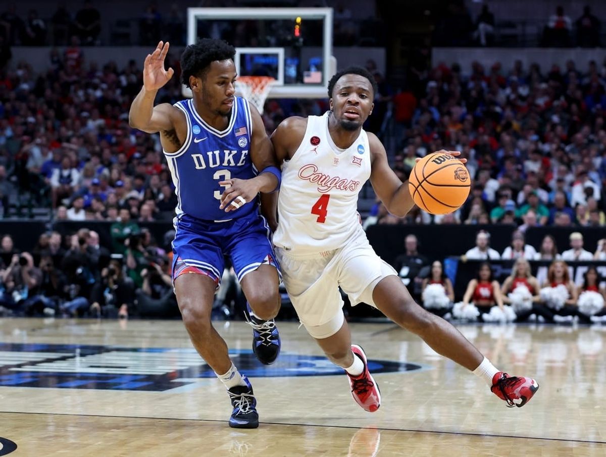 Mar 29, 2024; Dallas, TX, USA; Houston Cougars guard L.J. Cryer (4) drives against Duke Blue Devils guard Jeremy Roach (3) during the first half in the semifinals of the South Regional of the 2024 NCAA Tournament at American Airlines Center.